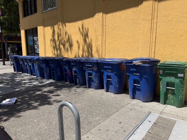 Row of residential trash and recycling bins on a Santa Monica sidewalk